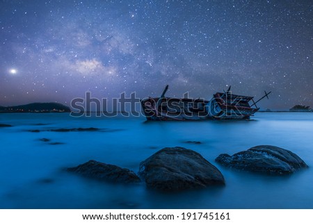 Fishing boat sinkine night view star blackground