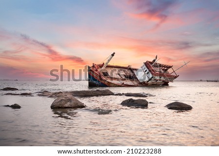Fishing boat capsize sunset blackground