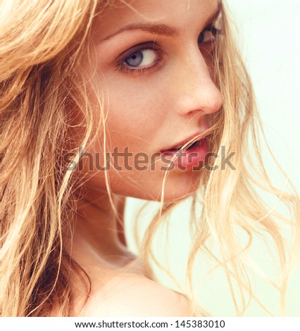 Portrait Of The Beautiful Girl Close-Up, The Wind Fluttering Hair.