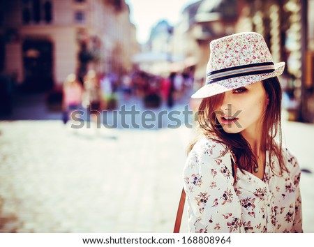 Portrait Of Beautiful Girl In Hat Outdoors
