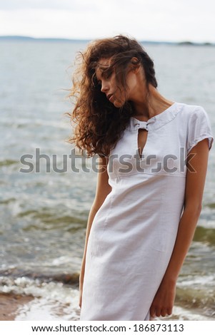 Portrait of the beautiful girl, the wind fluttering hair.