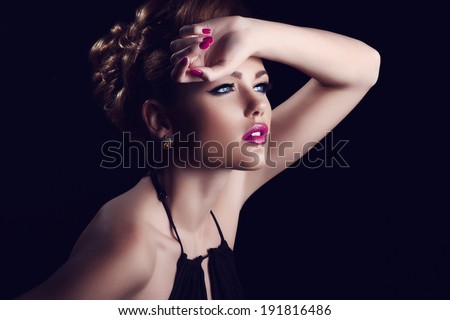 Portrait of beautiful girl in the studio with clean skin and bright makeup