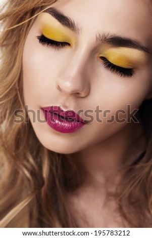 Portrait of beautiful girl with bright makeup, eyes closed