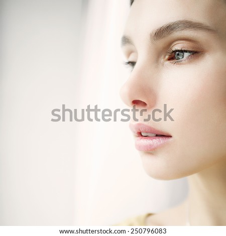 Portrait of a beautiful young girl face close-up, concept of health and beauty
