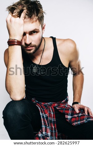 Handsome young male model in the studio, lifestyle