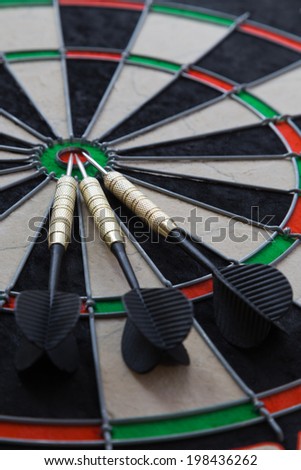 three darts on darts board