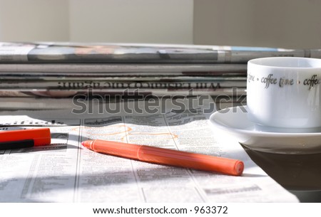 morning coffee with fresh newspapers (in search for the job)