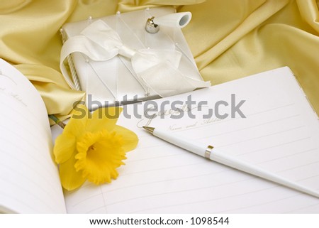daffodils on the wedding guest book with pen