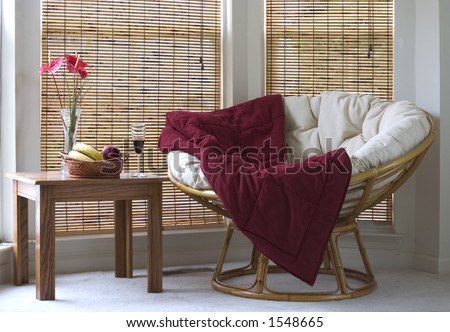 papasan chair living room on Papasan Chair Near Coffee Table With Wine And Fruits Stock Photo