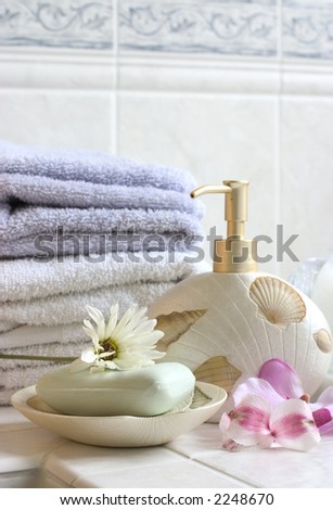 bath essentials ( soap, candle, towels, flowers)