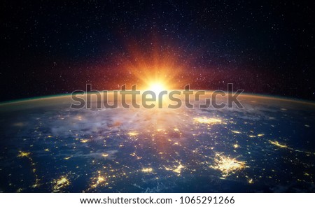 Earth, sun, star and galaxy. Sunrise over planet Earth, view from space. Elements of this image furnished by NASA
