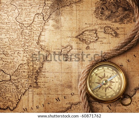 old compass on vintage map 18 centuries