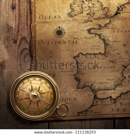 old compass on vintage map (France, Spain, England, Portugal, Holland, Denmark author Pierre Du Val (1618-1683) Paris. France 1666 )