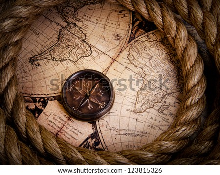 old compass and rope on vintage map 1752