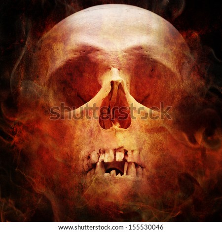 skull in flame on dark background