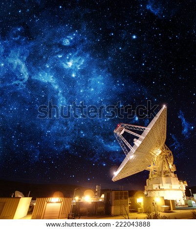 Satellite Antenna under beautiful star in blue sky. Elements of this image furnished by NASA.