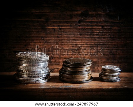 ancient coins on the wooden shelf