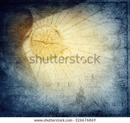 Vintage golden compass with nautical map background.