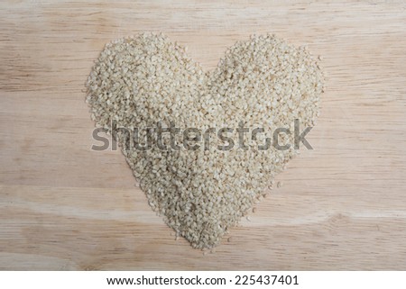 sesame arrange as the heart shape on the wood block