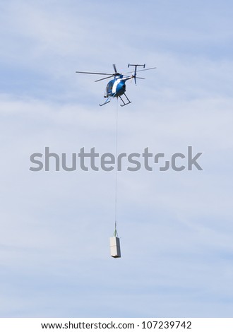 Helicopter carrying a load