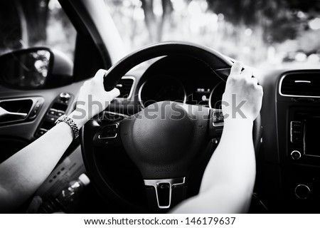 lady is learning drive a car catch steering wheel