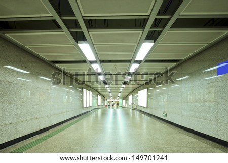 business people waking in metro station for transfer