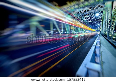 some car fast on road across the steel  construction bridge in guangzhou beside pearl river