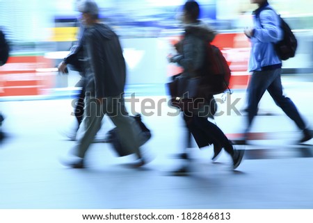 business people walking in train station in taiwan