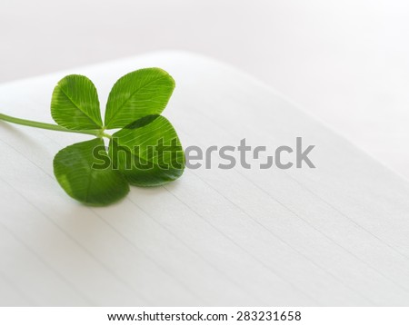Four leaves and letter paper