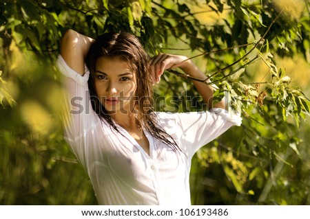 young sexy woman  in a wet shirt,series of portrait outdoors