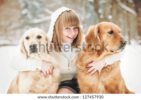 Woman and two lovely golden retriever