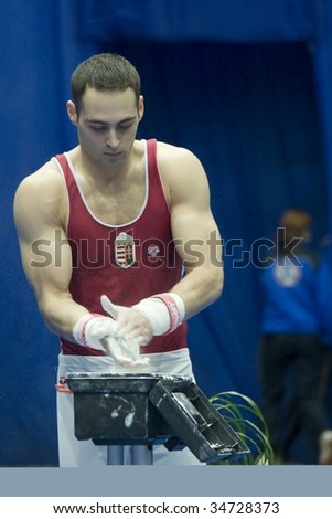KIEV, UKRAINE - MARCH 8: Alexander Vaskin prepares to do exercises at sporting gymnastics 