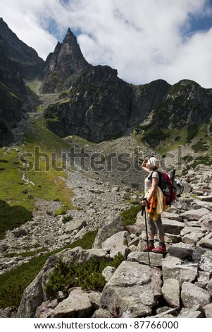 Backpacker girl tourist exploring the Tatra mountains national park, Poland.
