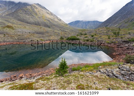 Mountain landscape with pond, Ural Mountains, Russia.