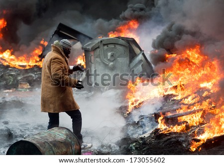 KIEV UKRAINE 23 JANUARY 2014 Unknown demonstrator in mask at the Independence square during Ukrainian revolution on January 23 2014 in Kiev Ukraine KIEV UKRAINE 23 JANUARY 2014 Unknown demonstrator in mask at the Independence square during Ukrainian revolution on January 23 2014 in Kiev Ukraine