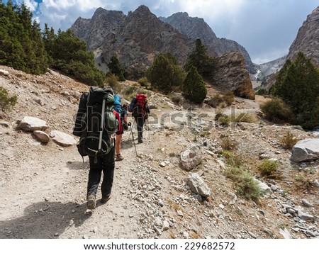 Hiker in Fann mountains, central asia, Tajikistan.