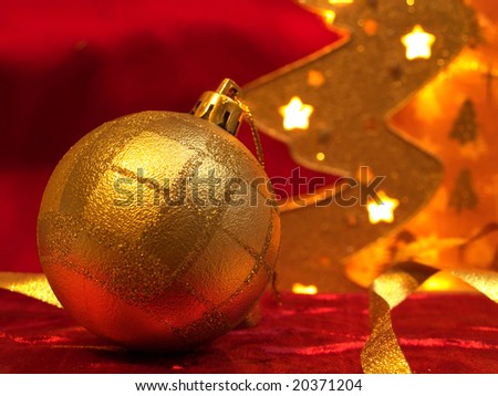 Christmas gold ornaments on the red background