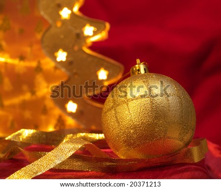 Christmas gold ornaments on the red background