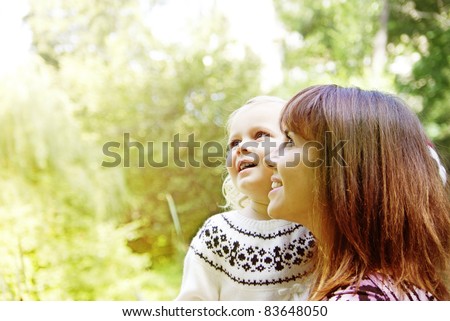 Portrait of a joyful mother and her daughter smiling