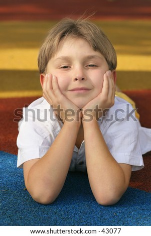 Bright Future.  Boy on colourful playground backdrop with happy disposition/outlook