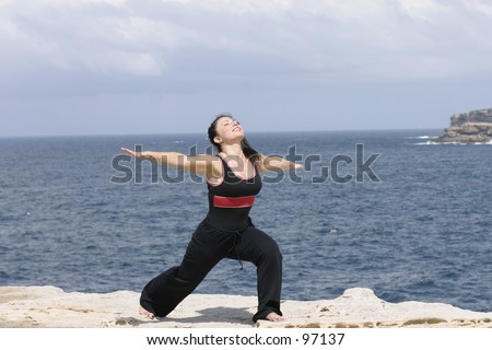 Stretching lunge, ocean backdrop