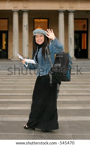 Back to School - A college or university student waving to friends