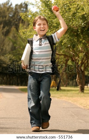 Back to School: A jovial or enthusiastic child holding a laptop walks to school.