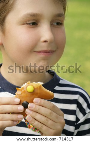 Child eating a sweet treat.