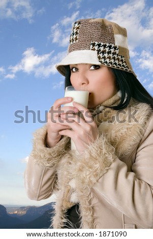 Dairy goodness.   A woman with a glass of fresh milk.