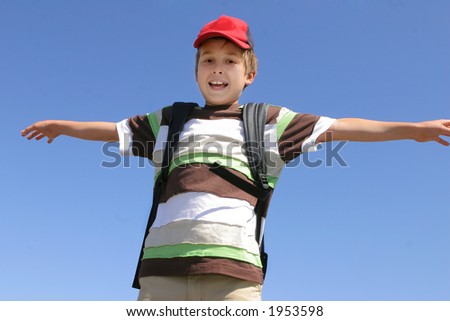 A child with arms outstretched ready to fly