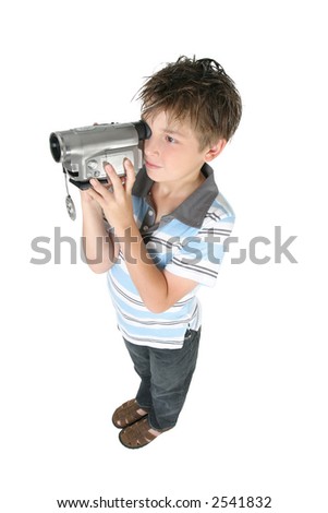 Stamding boy filming with a digital video camera.   White background,