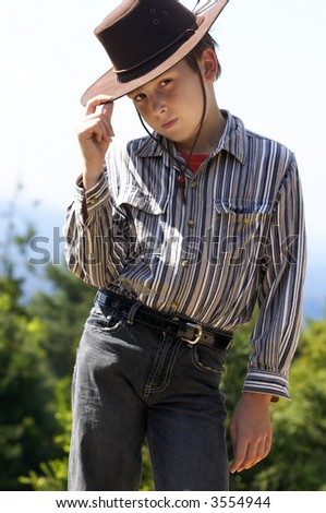 stock-photo-a-courteous-country-boy-in-denim-jeans-and-button-shirt-tips-his-hat-3554944.jpg