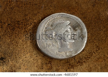 M. Porcius Cato  Rome. Front side of Roman Republic (200-30bc) silver coin AR denarius (89bc) depicting female draped hair taken in chignon.  Behind the nape of neck, ROMA, Under neck, M.Cato.