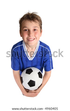 A young boy in soccer uniform ready to play soccer.
